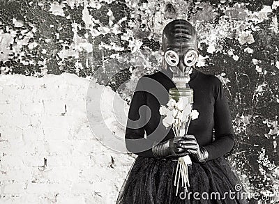 The girl in a gas mask. The threat of ecology. Stock Photo